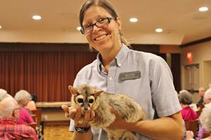 Educator Robin holds a ringtail